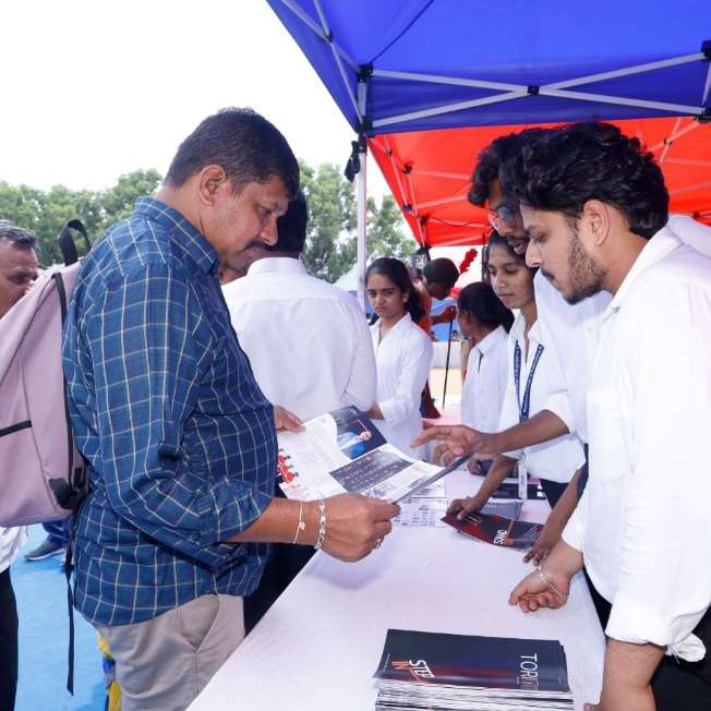Faculty engaging at the campus AI booth
