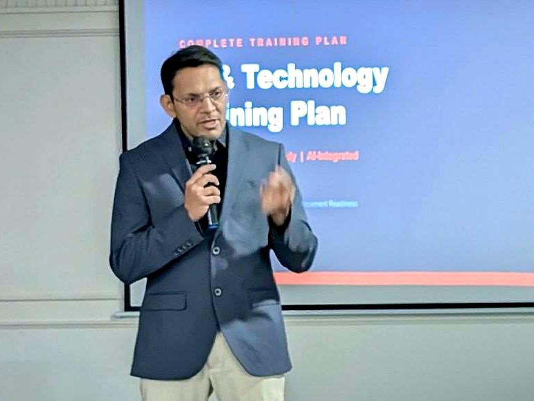 The CEO presenting the AI and technology training plan to faculty
