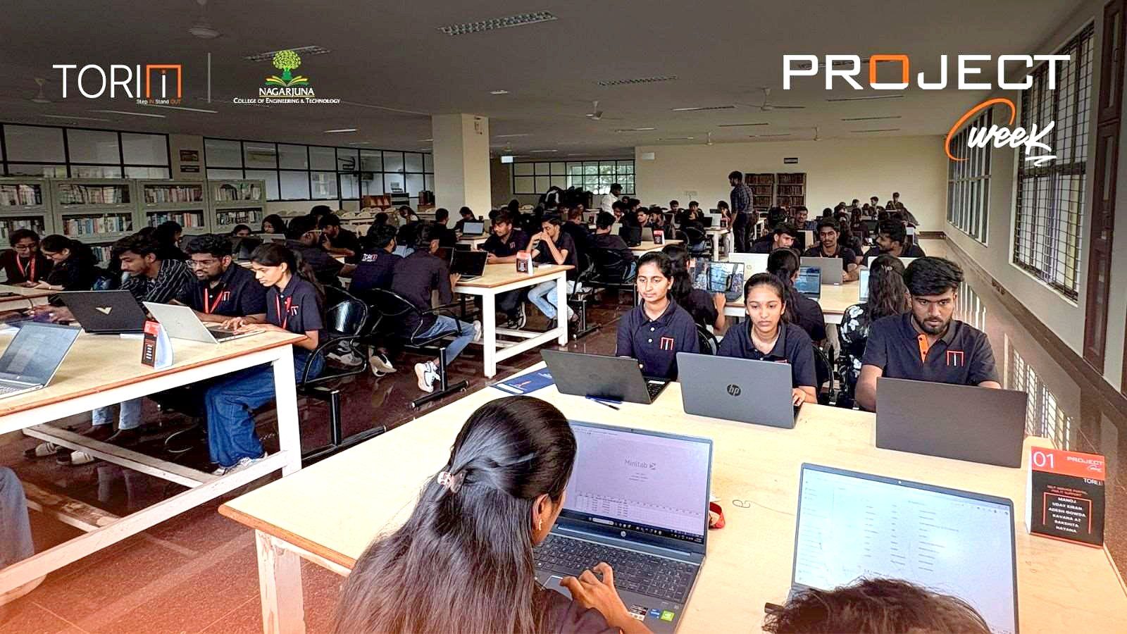 Students building projects across the library hall